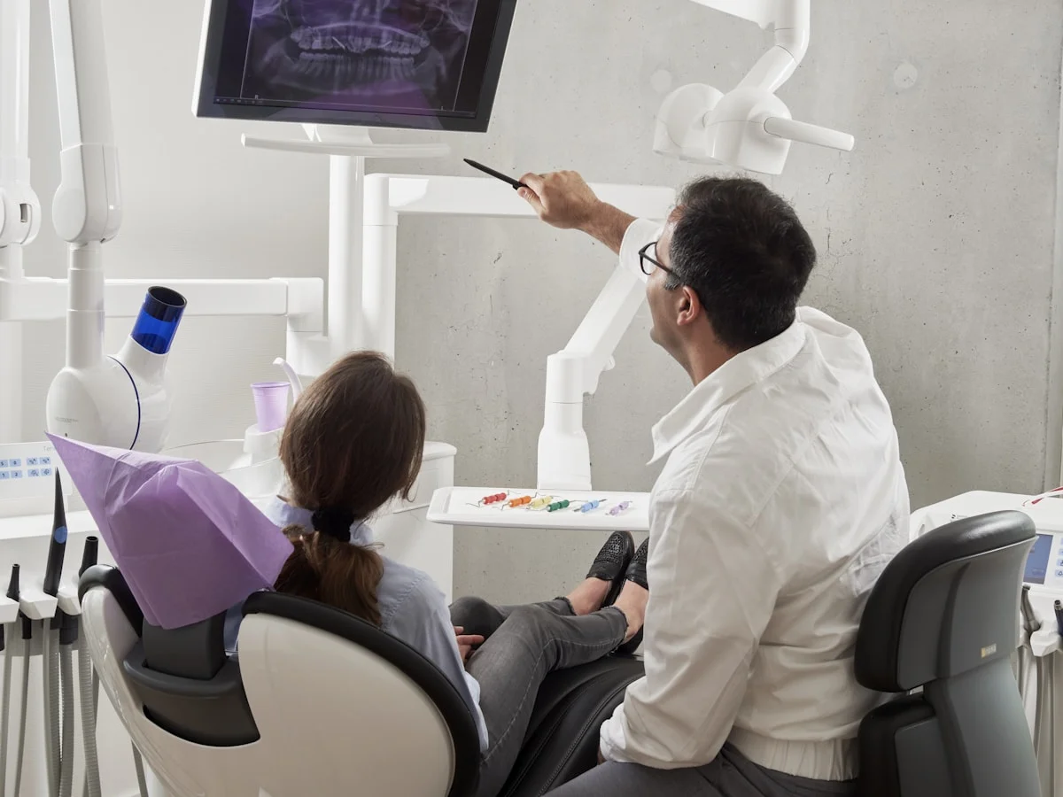 Dentist explaining an X-ray to a patient